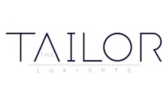 A black poster with white text that reads "The Tailor Lux Plus".