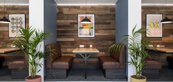 a lounge area with chairs and a table