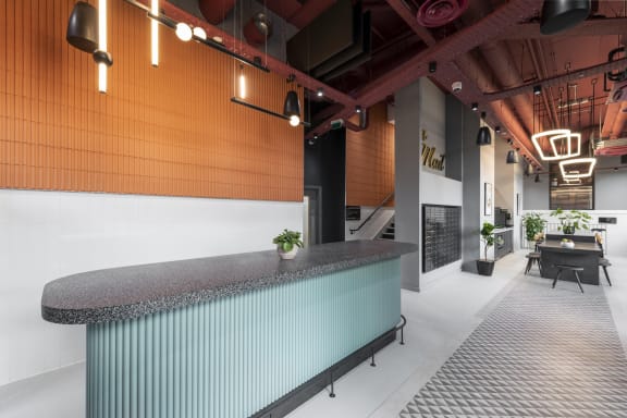 a reception desk in a lobby of a building