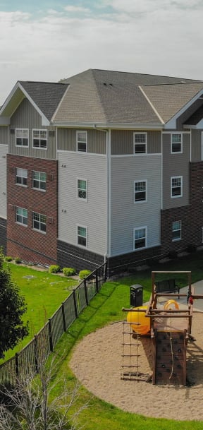 an aerial view of an apartment building with a playground