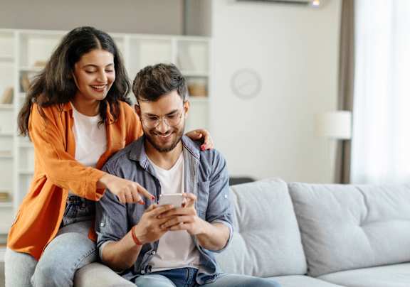 Couple Sitting on the Couch at The Arbors at Smyrna in Smyrna, GA, 30080
