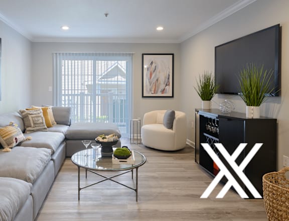 a living room with a large couch and a tv