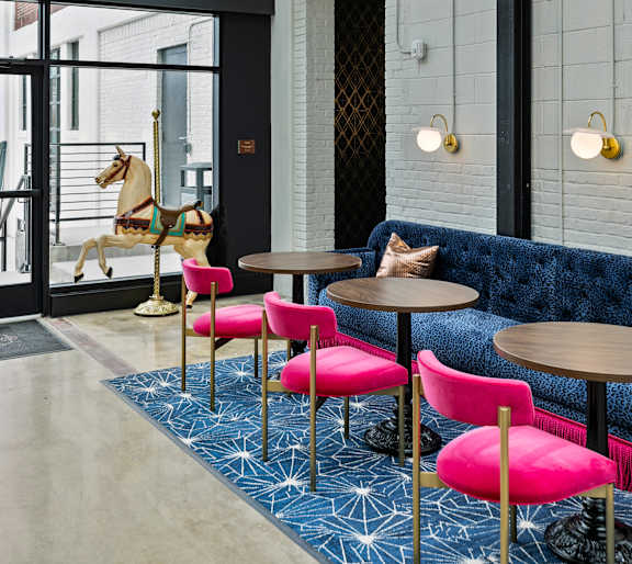 A modern interior with a brick wall and a glass ceiling at The Carousel, Virginia