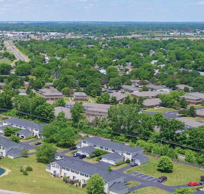 A bird's eye view of a residential area with houses and trees.