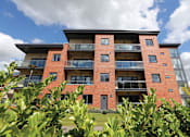 Thumbnail 3 of 9 - main view of the front of an apartment building
