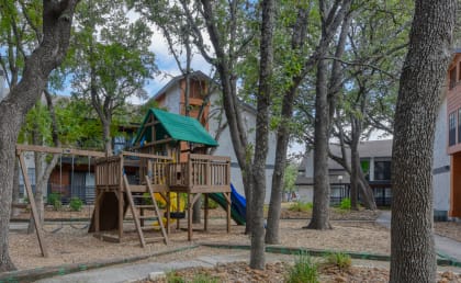 a playground at the whispering winds apartments in pearland, tx