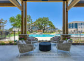 Thumbnail 11 of 28 - the preserve at ballantyne commons pool area with chairs and tables and a pool