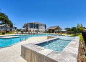 Thumbnail 10 of 28 - the preserve at ballantyne commons pool and spa with apartments in the background