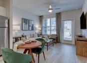 Thumbnail 27 of 28 - an open living room and dining room with a table and chairs at Estraya Boerne, Texas, 78006