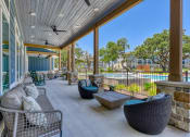 Thumbnail 9 of 28 - the preserve at ballantyne commons covered patio with furniture and a pool