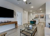 Thumbnail 19 of 28 - a living room with a couch and a glass coffee table at Estraya Boerne, Boerne