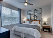 Thumbnail 26 of 28 - create a bedroom that is spacious and cozy with a large bed and a ceiling fan at Estraya Boerne, Texas, 78006