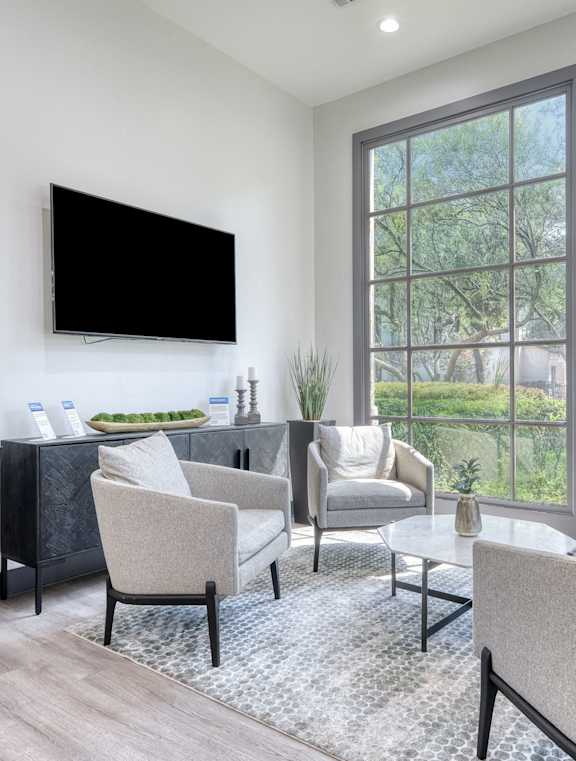 a large kitchen with a marble counter top and a dining room