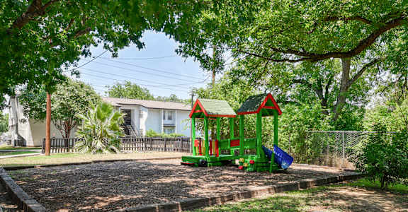 a pretend playground in a park with trees