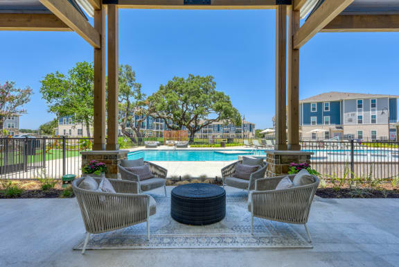 the preserve at ballantyne commons pool area with chairs and tables and a pool