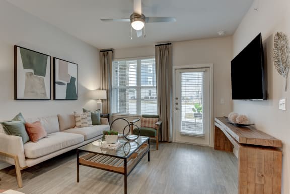 a living room with a couch and a coffee table and a tv at Estraya Boerne, Texas, 78006