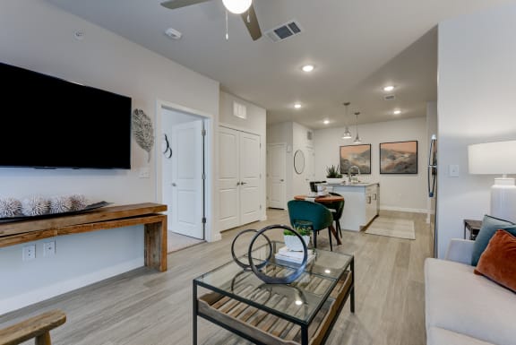 a living room with a couch and a glass coffee table at Estraya Boerne, Boerne