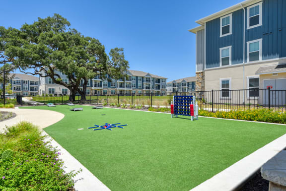 an image of a playground in front of an apartment building at Estraya Boerne, Boerne