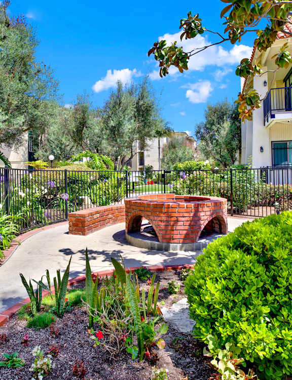 a view of a swimming pool at the resort on a sunny day at Willow Tree Apartments, California