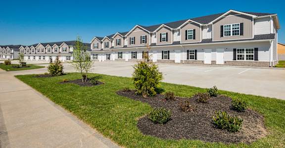 Row of houses with clear blue sky at Arrowood Farms, Tennessee, 37042