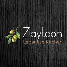 a logo for a lebanese kitchen on a black background