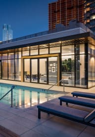 the pool on the rooftop of a building in the city at night at The Lively, New Jersey, 07302