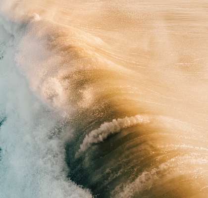 a large wave crashing into a body of water  at Casa De Oro Apartments, Torrance, CA
