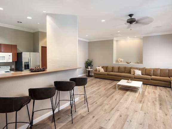 A modern living room with a kitchen area at Vintage at Scottsdale, SCOTTSDALE, AZ 85260