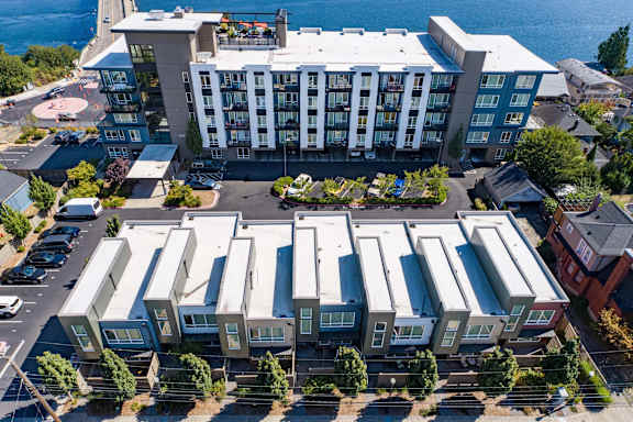 A large building with a parking lot in front of it.