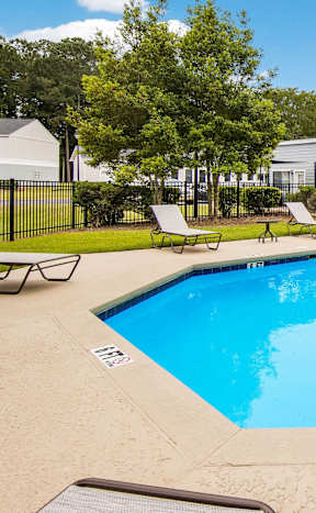 our resort style swimming pool is next to our apartment buildings