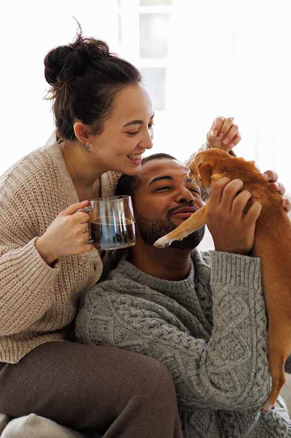 Man and Woman playing with Dog at Amara Luxury Apartments, Sacramento