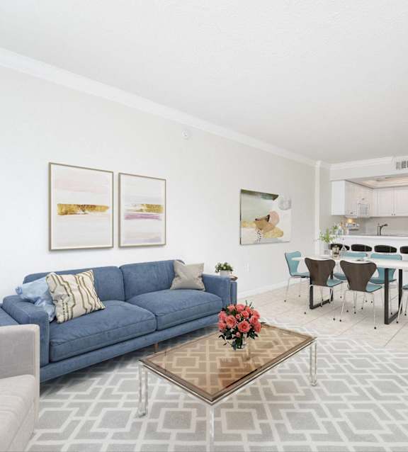 a bedroom with a bed and a kitchen and a living room