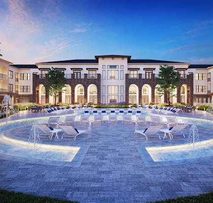 Exterior of Berkshire Exchange with lounging chairs and fountain in Spring, TX