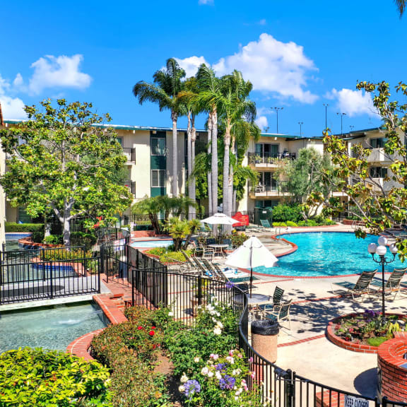 a view of a swimming pool at the resort on a sunny day  at Willow Tree Apartments, Torrance, CA, 90505