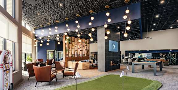 Miniature golf course is set up inside a furniture store at 51 South Apartments, White Plains, NY, 10601