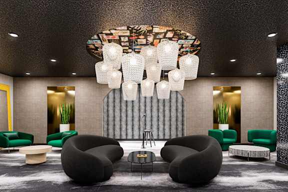 A modern lounge area with a large chandelier and comfortable seating. at Elements Apartments*, Irvine