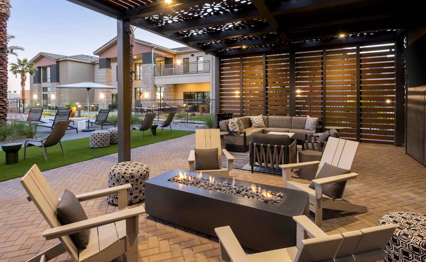Outdoor fireplace and seating at Elysium.