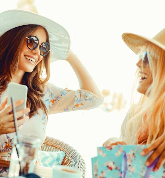 Two Woman Laughing at Garden at 3Roots, San Diego, CA 92126