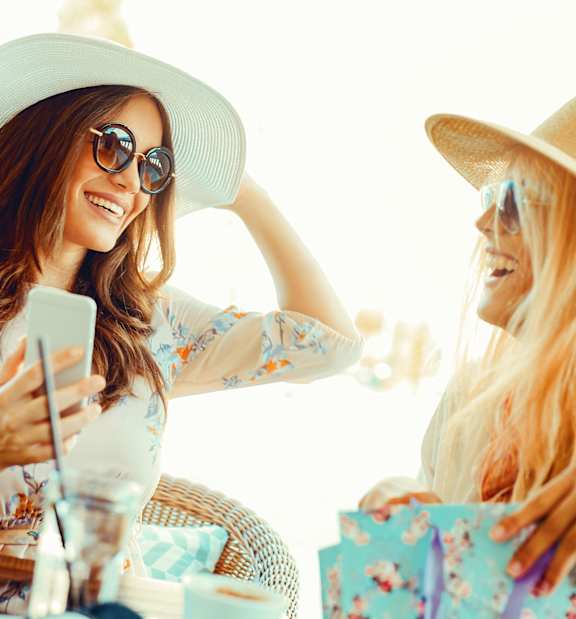 Two Women wearing hats at Woodbridge Gardens, California, 91602