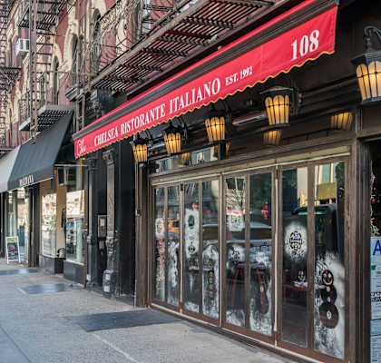 A street view of a restaurant named "Cherry Restaurant Italiano" with a red awning and a sign that reads "108."