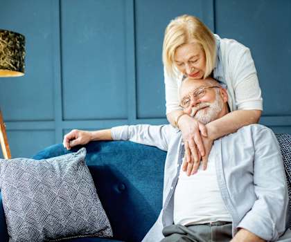 Woman is back hugging a man at Hadley Apartments, Escondido, California