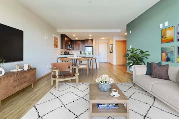 A living room with a coffee table in the center and a couch to the right.