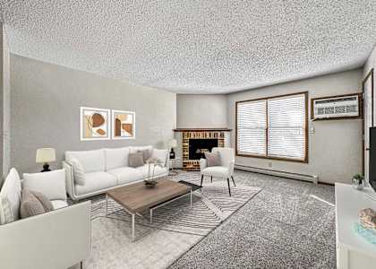a living room with white furniture and a fireplace at Creekstone Falls, South Dakota, 57106
