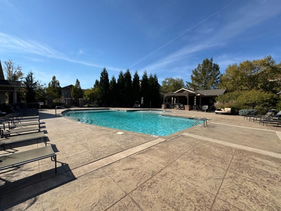 a swimming pool at the resort on a sunny day at Sovereign at Overland Park, Overland Park, KS 66213