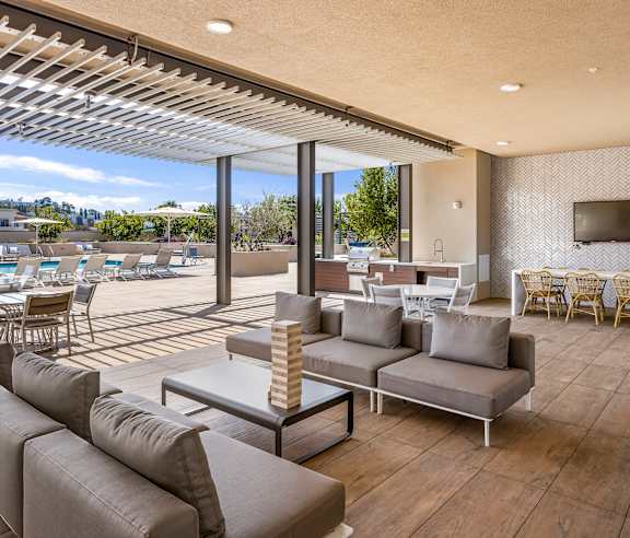A modern outdoor living space with a patio and a covered area. at Casa Mira View Apartments, San Diego, CA 92126