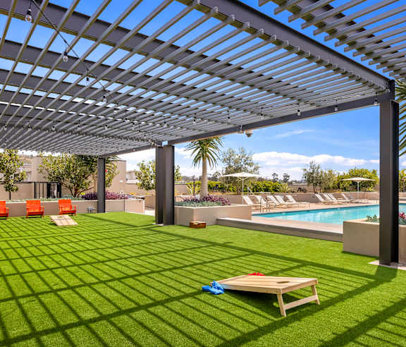 A patio with a pool and a table. at Casa Mira View Apartments, San Diego, CA 92126