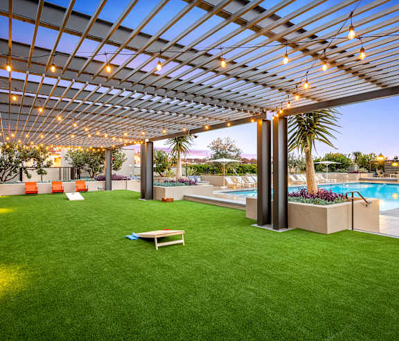 A backyard with a pool and a patio. at Casa Mira View Apartments, San Diego, CA 92126