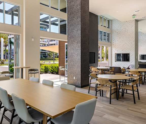 A conference room with a long table and chairs. at Elements Apartments, Irvine, CA