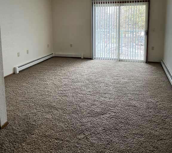 a living room with a couch and a table and a television