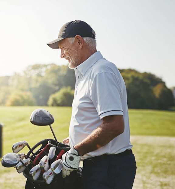 Man is standing on a golf course at Hendrix Apartments, Escondido, CA, 92026